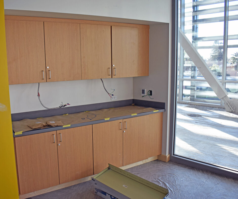 Plastic laminate casework is featured throughout the new center. These upper and lower cabinets are on the first floor.